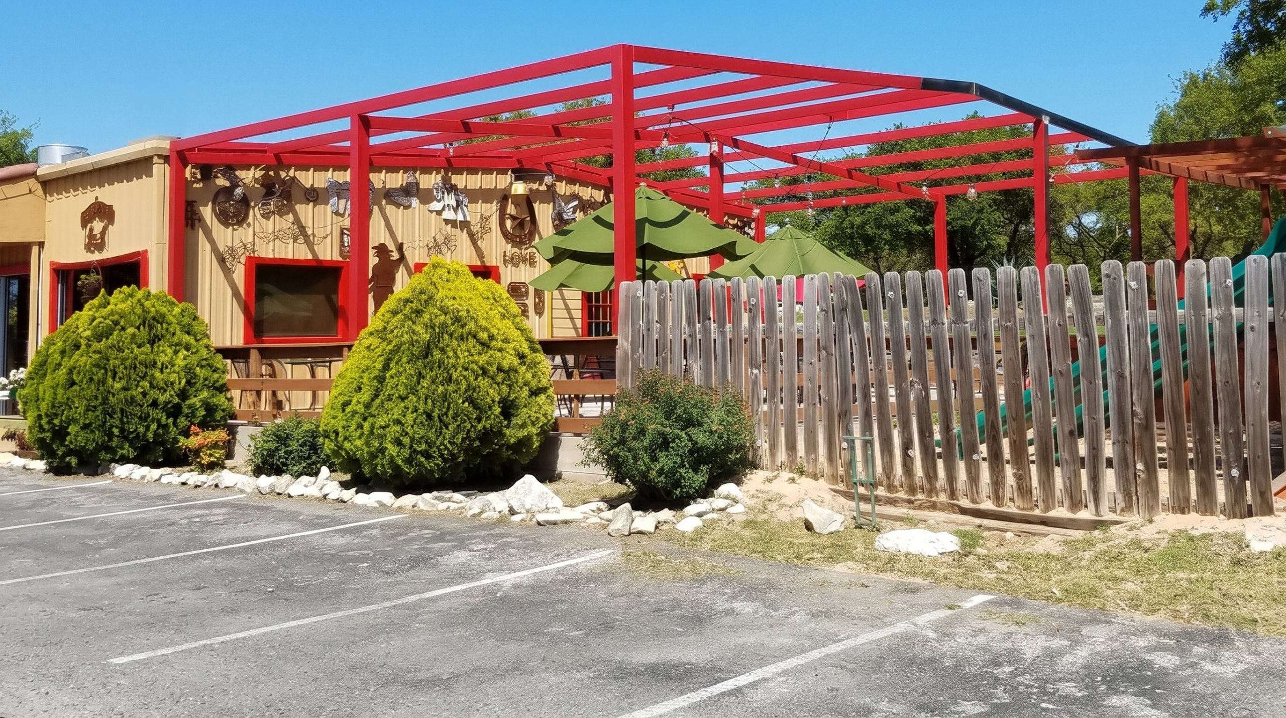 Red steel patio cover frame at Sandra's Cantina in Spring Branch, Texas