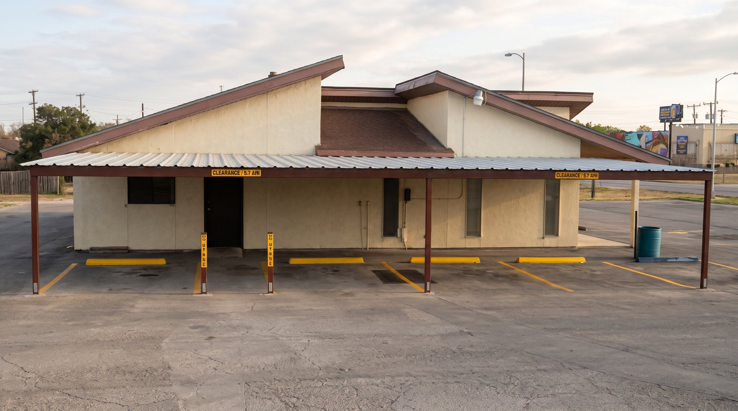 Commercial steel carport covering parking spaces in San Antonio, Texas